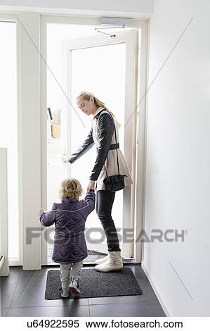 Young woman leaving house with sister (4-5) View Large Photo Image Stock Photography - Young woman leaving house with sister (4-5). Fotosearch