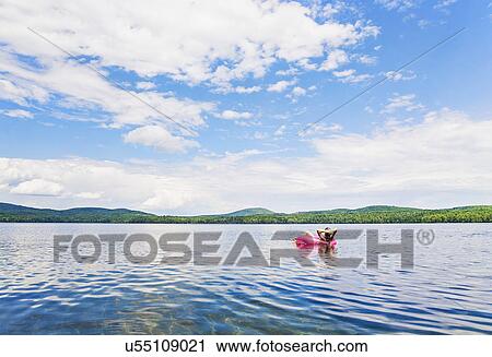 Young woman relaxing on lake in pool raft View Large Photo Image Stock Image - Young woman relaxing on lake in pool raft. Fotosearch