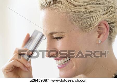 Young woman spending money View Large Photo Image Stock Photo - Young woman spending money. Fotosearch