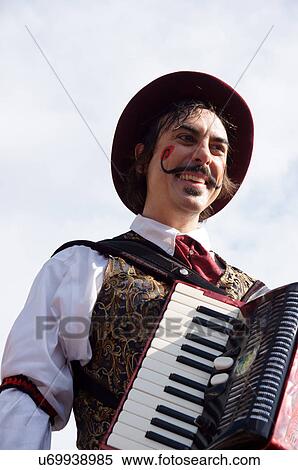 acordian player music man male on stilts act View Large Photo Image Stock Photography -  acordian player music man male on stilts act. Fotosearch