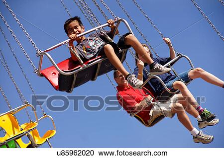 Stock Image -  aerial chair swing ride people kids children. Fotosearch