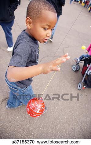 Stock Image -  albq balloon fiesta african american boy tween. Fotosearch