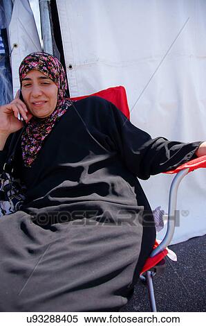 albq balloon fiesta arab woman female cell phone View Large Photo Image Stock Photography - albq balloon fiesta arab woman female cell phone. Fotosearch