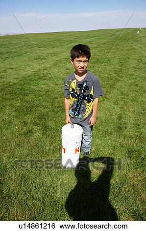 Stock Photograph -  albq balloon fiesta asian boy portrait headshot. Fotosearch
