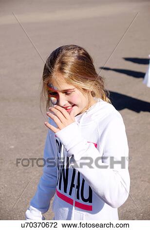 Stock Image -  albq balloon fiesta blond girl child kid face. Fotosearch