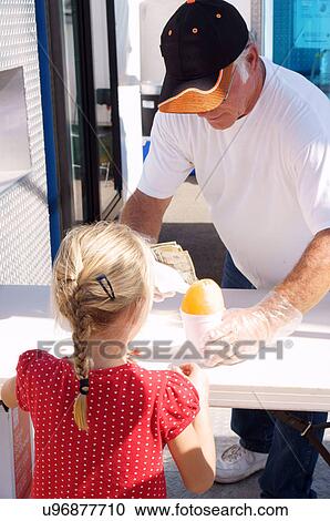 Stock Image -  albq balloon fiesta blond girl child kid buying. Fotosearch