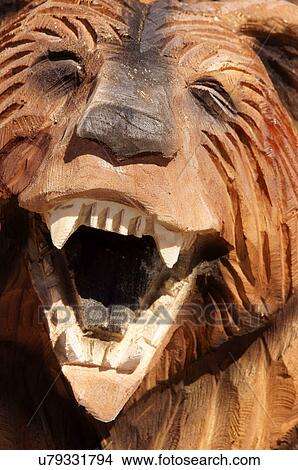 Picture -  albq balloon fiesta chain saw bear wood carving. Fotosearch