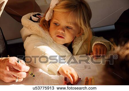 Stock Image -  albq balloon fiesta close-up baby girl toddler. Fotosearch
