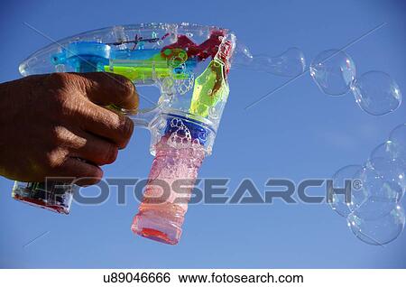 Stock Photograph -  albq balloon fiesta closeup water gun pistol. Fotosearch