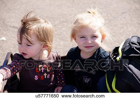 Stock Image -  albq balloon fiesta cute blonde blond baby twins. Fotosearch