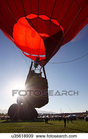 albq balloon fiesta early morning ascent sun red View Large Photo Image Stock Photo - albq balloon fiesta early morning ascent sun red. Fotosearch