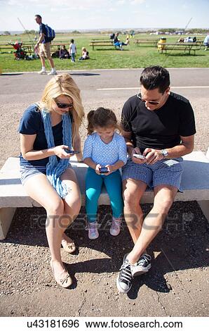 albq balloon fiesta family texts together stays View Large Photo Image Stock Photograph - albq balloon fiesta family texts together stays. Fotosearch