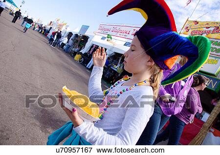 Stock Photo -  albq balloon fiesta girl child kid tween jesters. Fotosearch