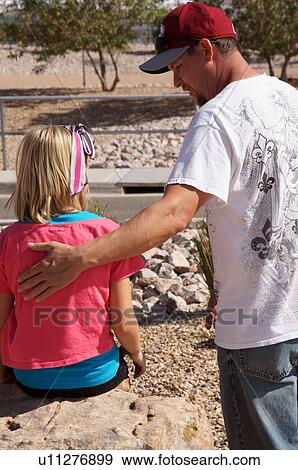 Stock Photo -  albq balloon fiesta man male putting hand little. Fotosearch