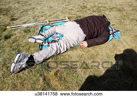 Stock Photo -  albq balloon fiesta man male sleeping blanket. Fotosearch