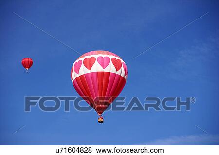 Stock Photo -  albq balloon fiesta red heart ascension hot-air. Fotosearch
