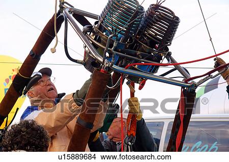 Picture -  albq balloon fiesta senior citizen aged man male. Fotosearch