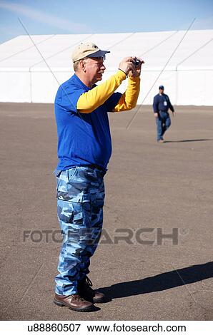 Stock Photo -  albq balloon fiesta senior citizen aged man male. Fotosearch