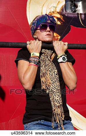 Picture -  albq balloon fiesta strong woman female hanging. Fotosearch
