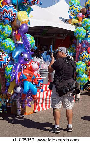 Stock Photo -  albq balloon fiesta taking picture midway. Fotosearch