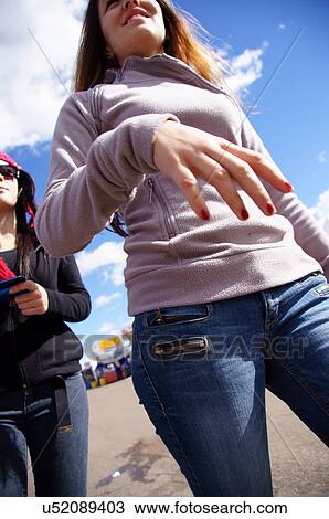 Stock Image -  albq balloon fiesta teen teenager girls walking. Fotosearch