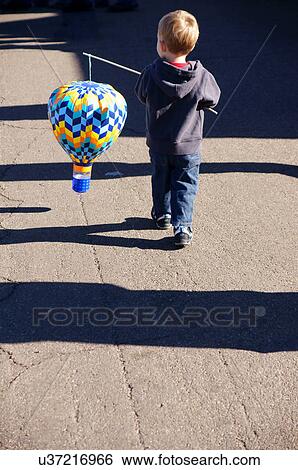 albq balloon fiesta young boy child kid carrying View Large Photo Image Stock Photograph - albq balloon fiesta young boy child kid carrying. Fotosearch