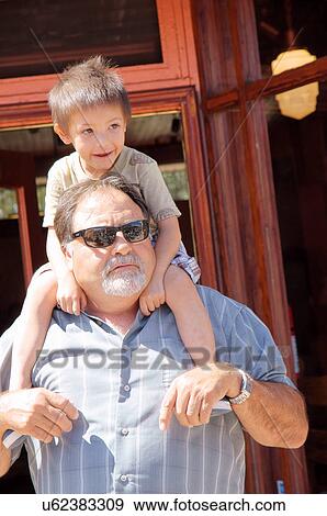 and grandson grandpa child kid on shoulders View Large Photo Image Stock Photo - and grandson grandpa child kid on shoulders. Fotosearch