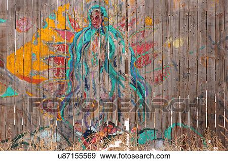 Stock Photo -  art on wood fence san isidro new mexico taos nm. Fotosearch