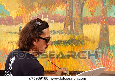 Stock Image -  artist ed sandoval taos new mexico painting a. Fotosearch