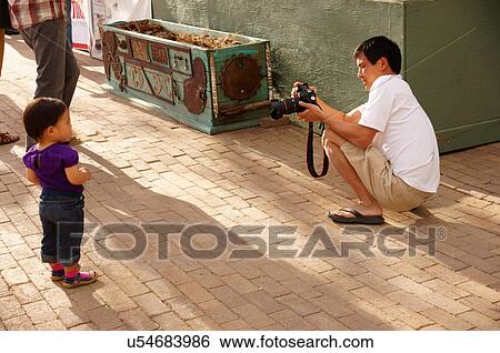 asian father dad parent taking picture of adult View Large Photo Image Stock Photograph - asian father dad parent taking picture of adult. Fotosearch