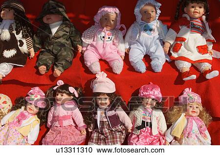Stock Image -  baby dolls dressed up el paso texas market. Fotosearch
