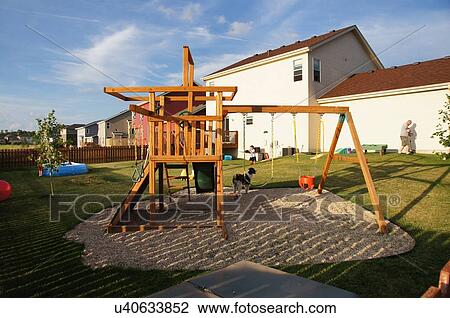 Backyard Playground Kids Dogs Urban Suburb Swing Stock Image