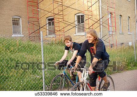 Stock Photograph -  biker bicyclist cyclist path woods exercise man. Fotosearch