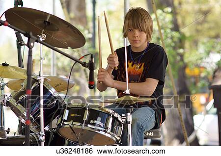 Stock Photograph -  boy male teen teenager drummer sequence drums. Fotosearch
