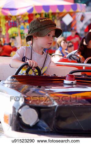 boy on ride children kids child kid amusement View Large Photo Image Stock Image - boy on ride children kids child kid amusement. Fotosearch