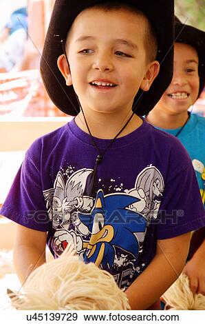 Stock Photo -  boy riding stick horse at the pee-wee stampede. Fotosearch