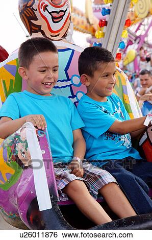 boys on carnival ride children kids child kid View Large Photo Image Stock Photograph - boys on carnival ride children kids child kid. Fotosearch