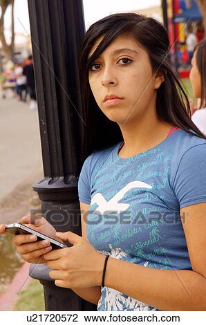 brunette teen teenager girl with iphone cell View Large Photo Image Stock Image - brunette teen teenager girl with iphone cell. Fotosearch
