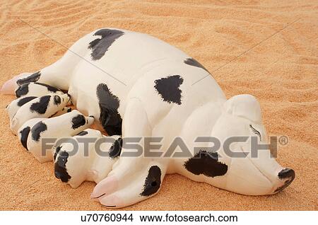 ceramic piglets mother sow suckling pigs suck View Large Photo Image Picture - ceramic piglets mother sow suckling pigs suck. Fotosearch