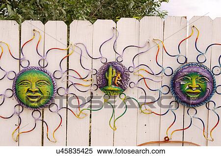 Stock Photography -  ceramic plates on white wood fence taos new. Fotosearch