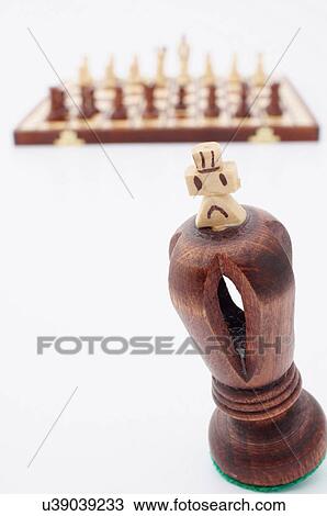 Stock Image -  chess black king shows signs anguish relief. Fotosearch