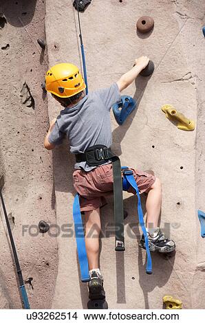 child kid rock climbing indoor sport children View Large Photo Image Picture - child kid rock climbing indoor sport children. Fotosearch