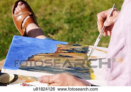 Stock Photograph -  closeup of artist hands drawing scenic senior. Fotosearch
