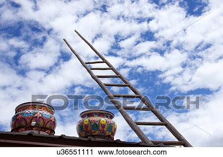 Stock Image -  colorful pottery and ladder taos new mexico nm. Fotosearch