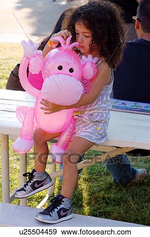 cute latino hispanic girl child kid playing with View Large Photo Image Stock Photo - cute latino hispanic girl child kid playing with. Fotosearch