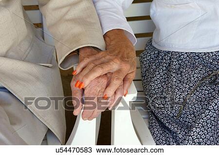 Stock Image -  elderly hands closeup affection tender love aged. Fotosearch