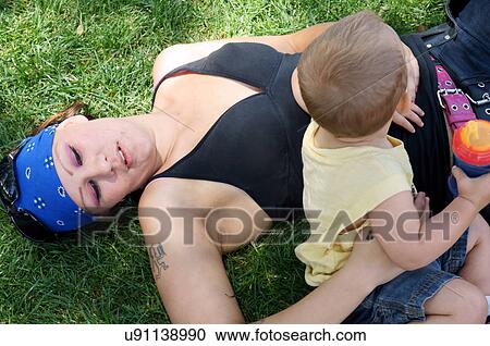 Stock Image -  female love child kid mother boy male las latino. Fotosearch