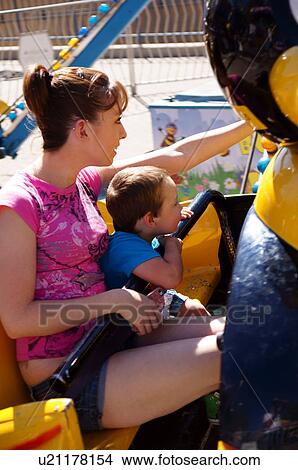 female mother and boy child kid on ride new View Large Photo Image Picture - female mother and boy child kid on ride new. Fotosearch