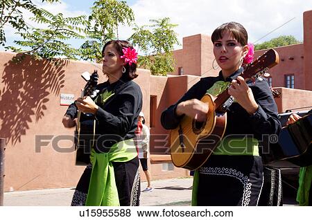 Stock Photo -  fiesta musicians parade girls women females fe. Fotosearch