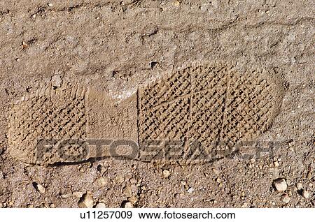 Stock Photo -  footprint in sand dirt mud abstract geometrics. Fotosearch